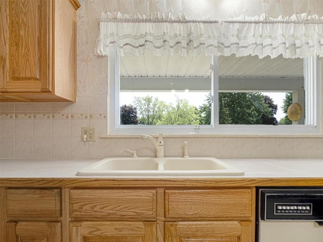 40 Colleen, Henrietta, NY 14534 - kitchen with dishwashing machine, light countertops, and backsplash
