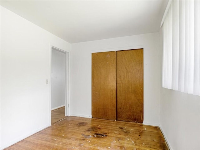 40 Colleen, Henrietta, NY 14534 - unfurnished bedroom with wood-type flooring and a closet