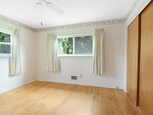 40 Colleen, Henrietta, NY 14534 - empty room with wood finished floors, healthy amount of natural light, and ceiling fan