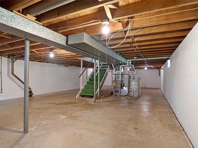 40 Colleen, Henrietta, NY 14534 - unfinished below grade area featuring gas water heater, stairs, heating unit, and concrete block wall