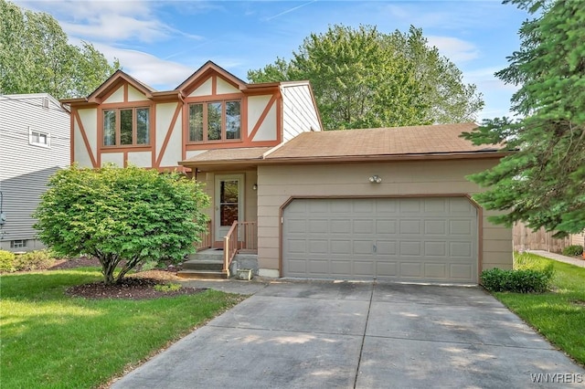 47 Brian Ave, Amherst, NY 14221 - english style home with concrete driveway, an attached garage, and a front yard