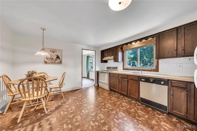 47 Brian Ave, Amherst, NY 14221 - kitchen with white appliances, under cabinet range hood, light countertops, pendant lighting, and dark brown cabinetry
