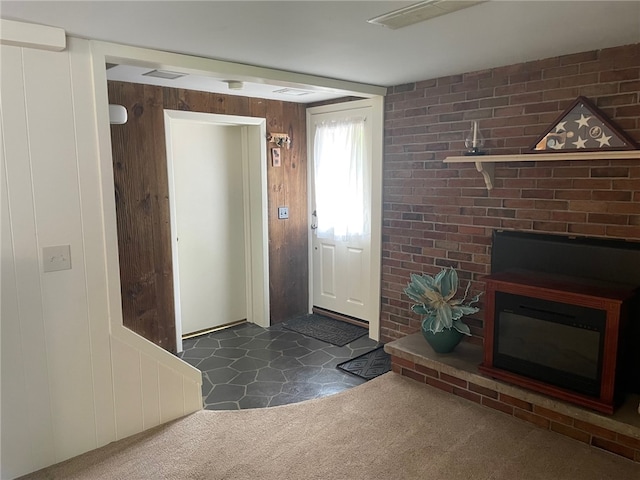 100 Huffer Rd, Parma, NY 14468 - foyer featuring dark carpet and wood walls