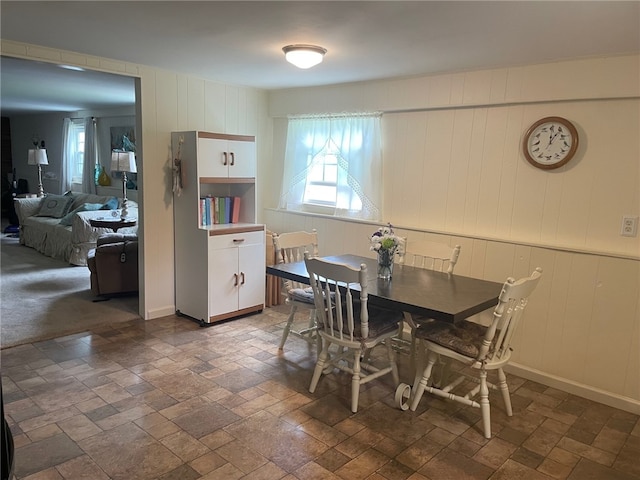 100 Huffer Rd, Parma, NY 14468 - dining room featuring stone tile flooring and a decorative wall