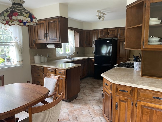 100 Huffer Rd, Parma, NY 14468 - kitchen with freestanding refrigerator, light countertops, and stone finish floors