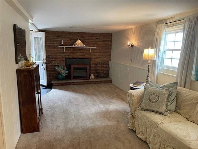 100 Huffer Rd, Parma, NY 14468 - living area featuring carpet flooring, a brick fireplace, and a decorative wall
