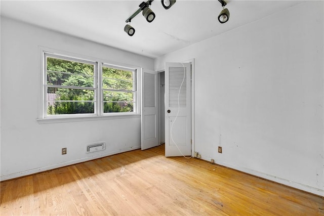 39 Scotch Ln, Irondequoit, NY 14617 - unfurnished bedroom featuring light wood-style flooring and baseboards