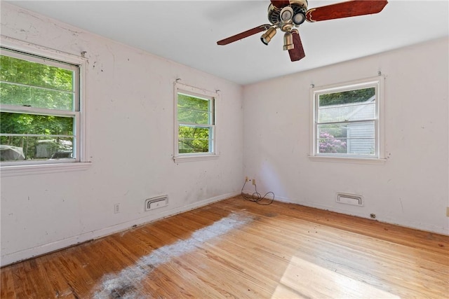 39 Scotch Ln, Irondequoit, NY 14617 - spare room featuring plenty of natural light, wood finished floors, and ceiling fan