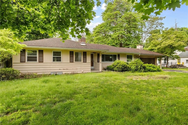39 Scotch Ln, Irondequoit, NY 14617 - ranch-style home featuring a chimney, an attached garage, and a front lawn