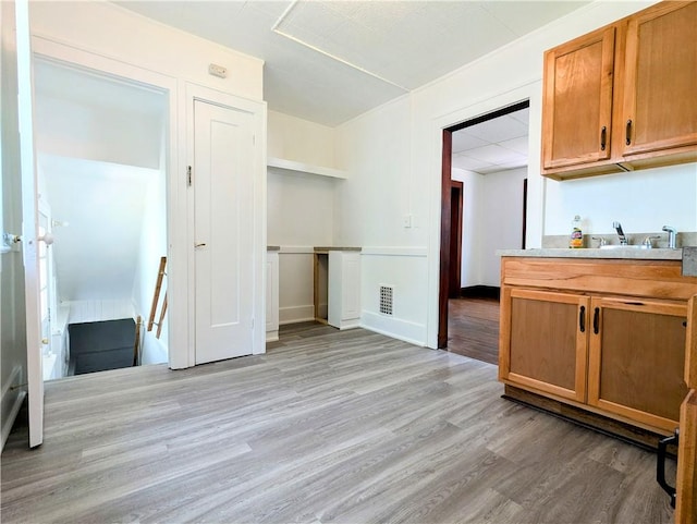 64 Saint Jacob St, Rochester, NY 14621 - kitchen with light wood-type flooring, brown cabinets, and light countertops