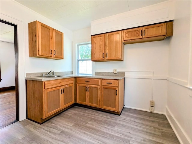 64 Saint Jacob St, Rochester, NY 14621 - kitchen featuring brown cabinets, light wood-type flooring, and light countertops