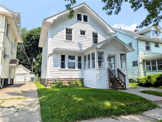 64 Saint Jacob St, Rochester, NY 14621 - view of front of property with an outbuilding, entry steps, a front lawn, and a sunroom