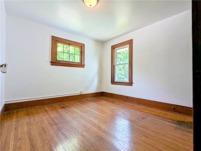 64 Saint Jacob St, Rochester, NY 14621 - spare room featuring wood-type flooring and baseboards