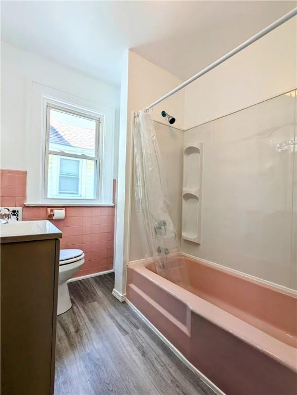 64 Saint Jacob St, Rochester, NY 14621 - bathroom with wood finished floors, shower / bath combination with curtain, tile walls, and vanity