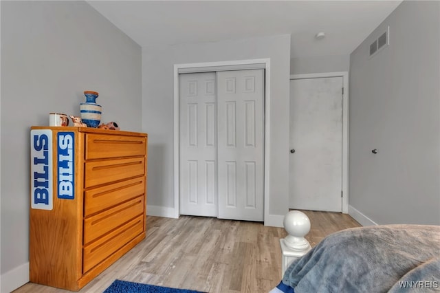 1202 Netherton Ct, Amherst, NY 14051 - bedroom featuring a closet and light wood-style floors