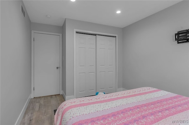 1202 Netherton Ct, Amherst, NY 14051 - bedroom featuring light wood-style flooring, recessed lighting, and a closet