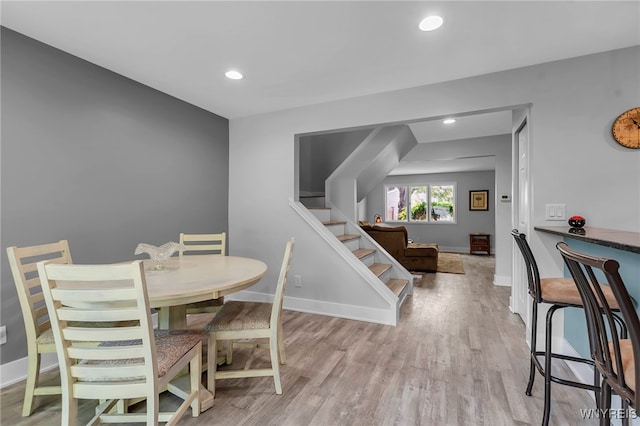 1202 Netherton Ct, Amherst, NY 14051 - dining space featuring stairway, wood finished floors, and recessed lighting