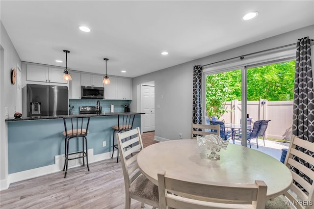 1202 Netherton Ct, Amherst, NY 14051 - dining area featuring recessed lighting and light wood-style floors