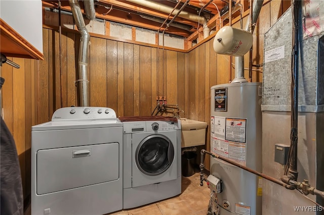 1202 Netherton Ct, Amherst, NY 14051 - laundry room featuring gas water heater, separate washer and dryer, wood walls, heating unit, and light tile patterned flooring