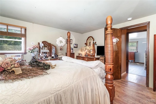 7042 Forbes Rd, Lenox, NY 13032 - bedroom featuring light wood-style floors and multiple windows
