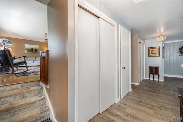 7042 Forbes Rd, Lenox, NY 13032 - hallway with wood finished floors and stairs