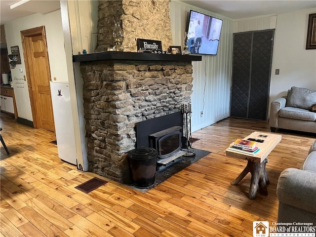 151 Chipmonk Rd, Allegany, NY 14753 - living area featuring hardwood / wood-style flooring and a wood stove