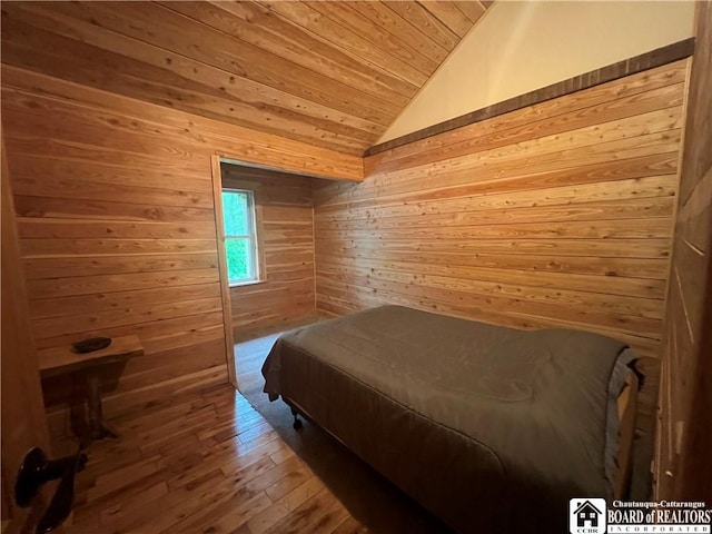 151 Chipmonk Rd, Allegany, NY 14753 - bedroom with wooden ceiling, lofted ceiling, wooden walls, and hardwood / wood-style flooring