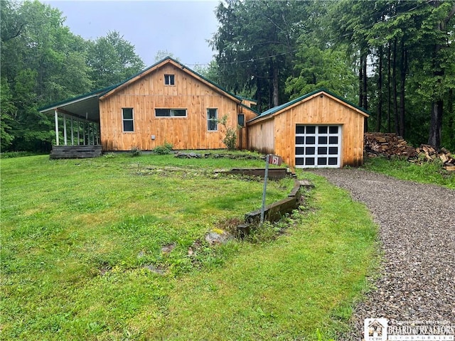151 Chipmonk Rd, Allegany, NY 14753 - property in mid-construction featuring a detached garage, gravel driveway, an outdoor structure, and a front yard