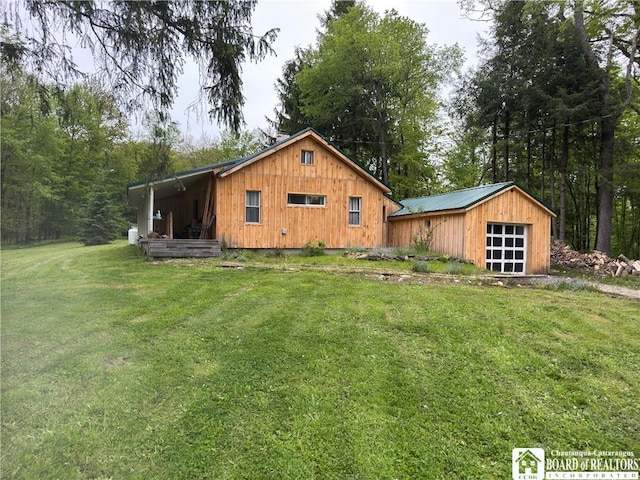 151 Chipmonk Rd, Allegany, NY 14753 - view of side of home featuring a lawn, an outbuilding, and a garage