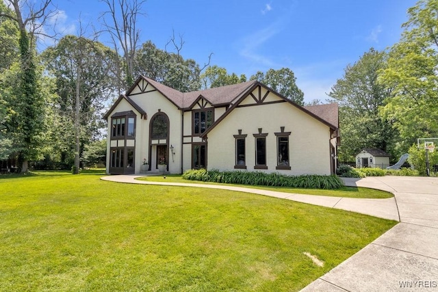 212 Crestwood Ln, Amherst, NY 14221 - tudor home featuring stucco siding and a front yard