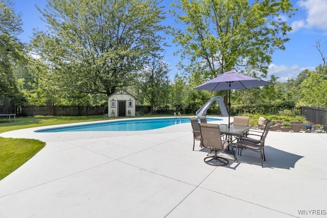 212 Crestwood Ln, Amherst, NY 14221 - view of swimming pool with a water slide, a shed, a patio area, a fenced backyard, and a trampoline