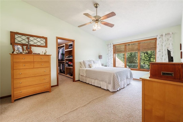 679 Galleon Dr, Webster, NY 14580 - bedroom featuring lofted ceiling, light colored carpet, a walk in closet, a ceiling fan, and a closet