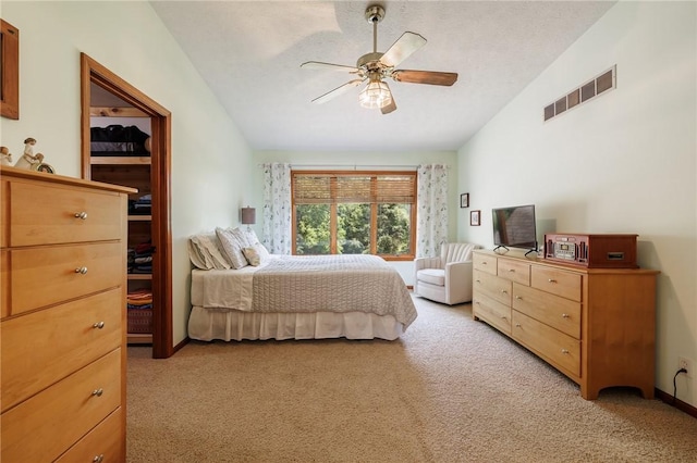 679 Galleon Dr, Webster, NY 14580 - bedroom featuring light colored carpet, vaulted ceiling, and a ceiling fan