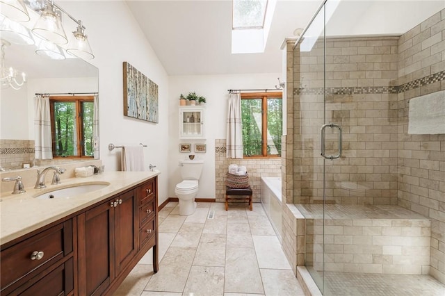 679 Galleon Dr, Webster, NY 14580 - bathroom with a skylight, lofted ceiling, vanity, a garden tub, and a shower stall