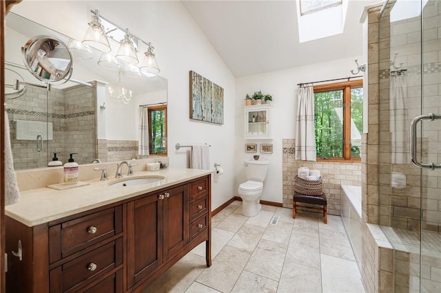 679 Galleon Dr, Webster, NY 14580 - bathroom with plenty of natural light, lofted ceiling, vanity, a garden tub, and a stall shower