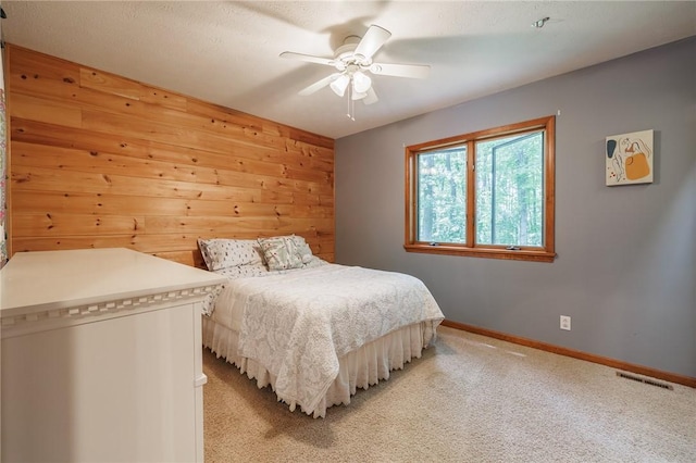 679 Galleon Dr, Webster, NY 14580 - bedroom with light carpet, wood walls, and ceiling fan