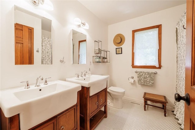679 Galleon Dr, Webster, NY 14580 - full bath with two vanities and toilet