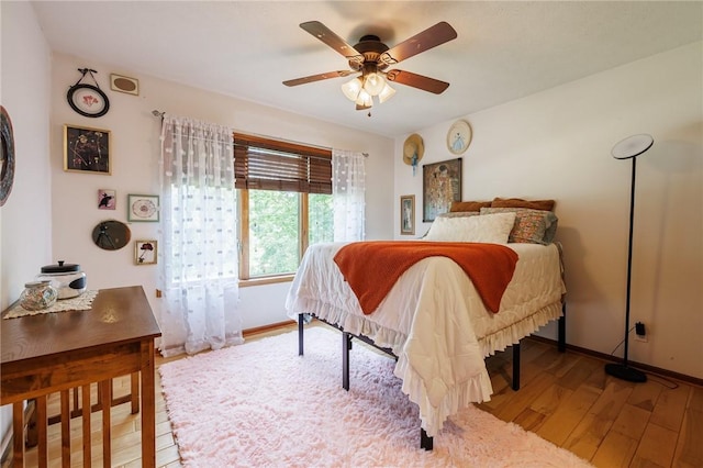 679 Galleon Dr, Webster, NY 14580 - bedroom with wood finished floors and a ceiling fan