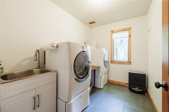 679 Galleon Dr, Webster, NY 14580 - washroom with washer and dryer, cabinet space, and tile patterned floors