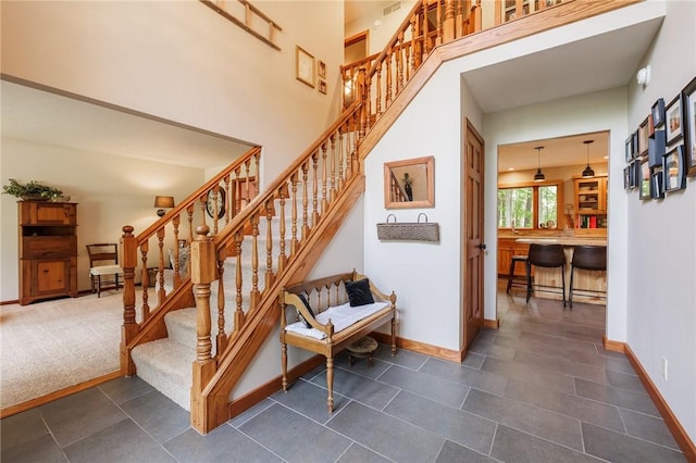 679 Galleon Dr, Webster, NY 14580 - stairway featuring baseboards and tile patterned flooring