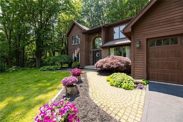 679 Galleon Dr, Webster, NY 14580 - view of front of home with a front yard and a garage
