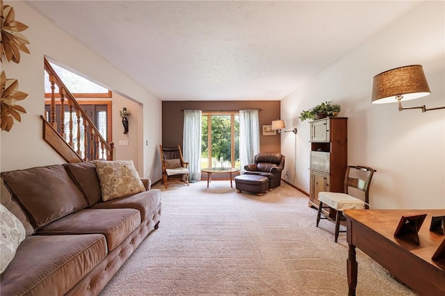 679 Galleon Dr, Webster, NY 14580 - living area featuring light carpet and stairway