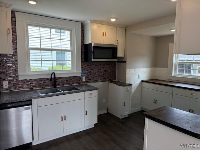 17 Orchard Ave, Evans, NY 14006 - kitchen with appliances with stainless steel finishes, dark wood-type flooring, dark countertops, white cabinetry, and recessed lighting