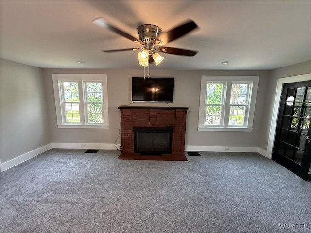 17 Orchard Ave, Evans, NY 14006 - unfurnished living room with healthy amount of natural light, carpet floors, a fireplace, and a ceiling fan