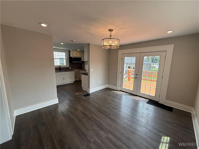 17 Orchard Ave, Evans, NY 14006 - unfurnished dining area with dark wood-type flooring, a chandelier, french doors, and recessed lighting