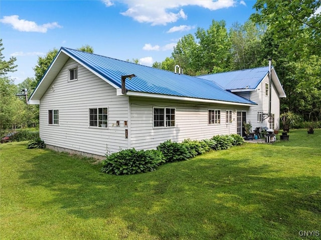 10066 Point Rock Rd, Lee, NY 13440 - view of property exterior featuring a lawn and a metal roof