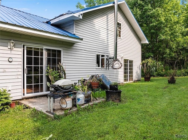 10066 Point Rock Rd, Lee, NY 13440 - rear view of house featuring a lawn, a metal roof, and a patio