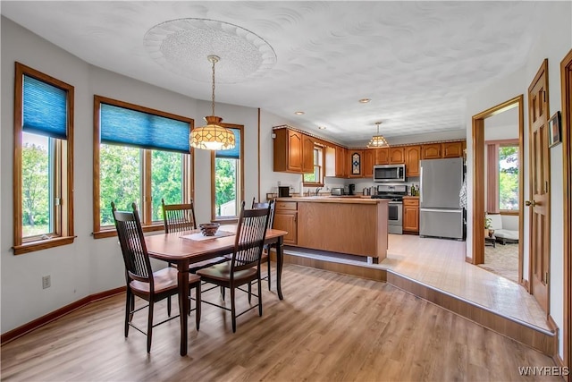 3851 Upper Mountain Rd, Cambria, NY 14132 - dining space featuring plenty of natural light and light wood-type flooring