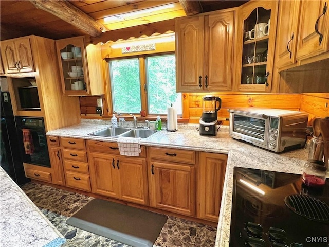 13 Popple Hill Rd, Fowler, NY 13642 - kitchen with black appliances, glass insert cabinets, brown cabinetry, and a wooden ceiling with exposed beams