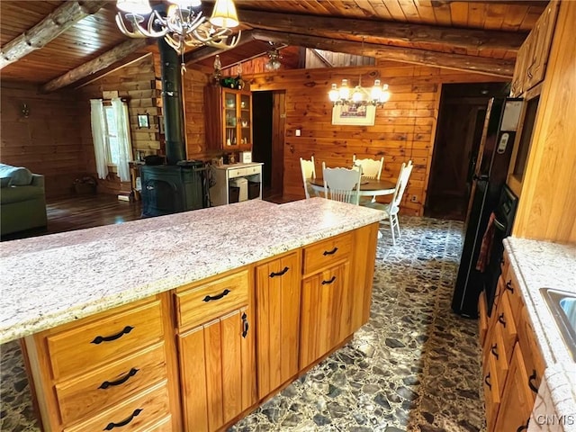 13 Popple Hill Rd, Fowler, NY 13642 - kitchen with a chandelier, wood ceiling, wood walls, open floor plan, and brown cabinets